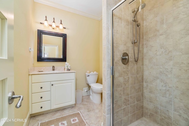 bathroom featuring an enclosed shower, tile floors, vanity with extensive cabinet space, toilet, and ornamental molding