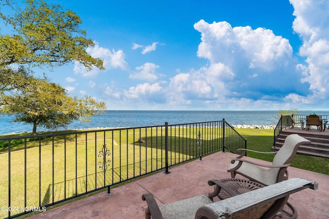 view of terrace with a balcony and a water view