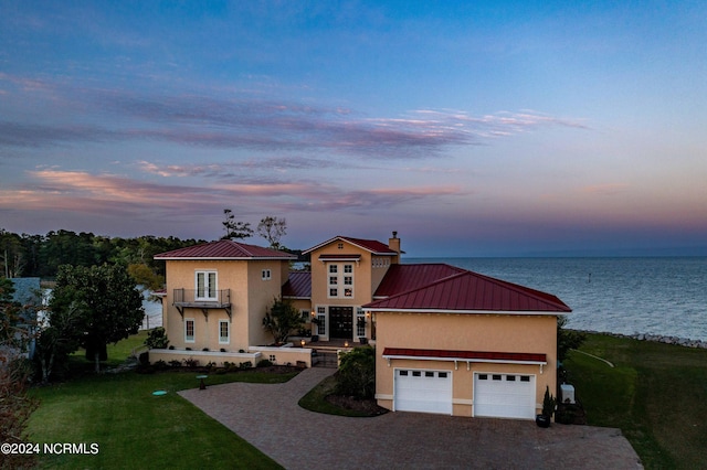 view of front of home with a water view