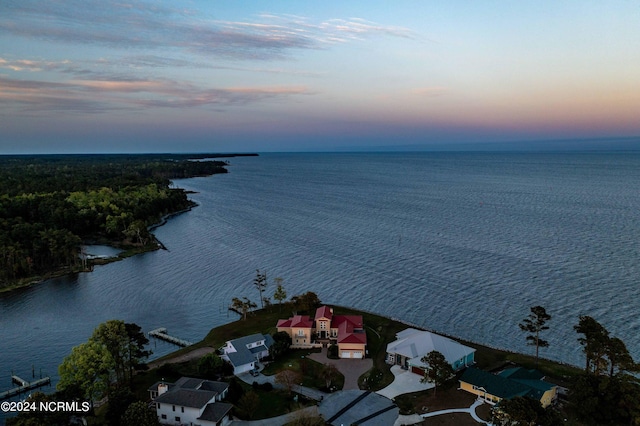 aerial view at dusk with a water view