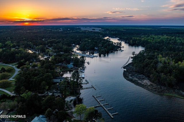 aerial view at dusk with a water view