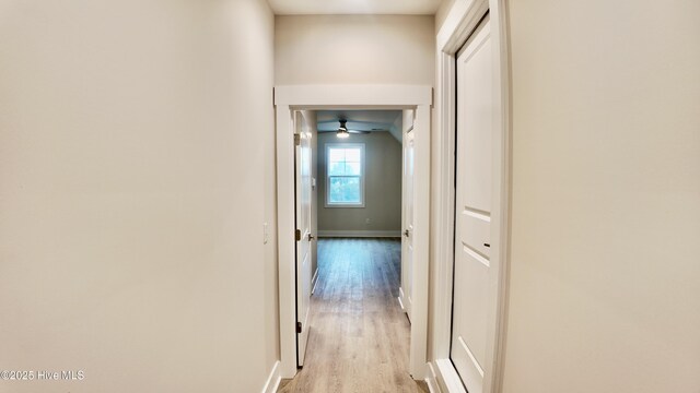 bonus room featuring ceiling fan, light wood-type flooring, and lofted ceiling