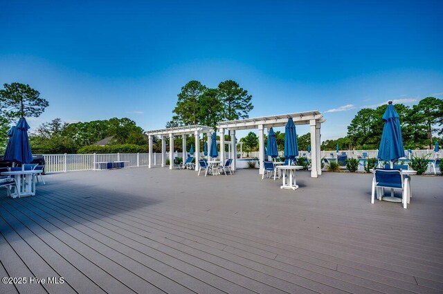 wooden terrace featuring a gazebo and a pergola