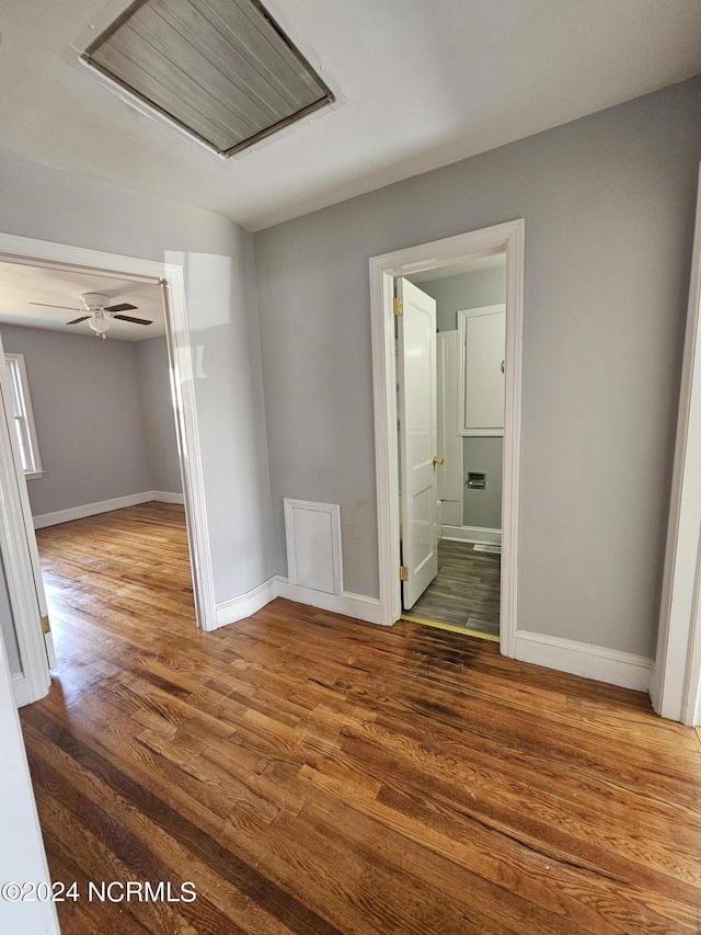 unfurnished room with hardwood / wood-style flooring and ceiling fan