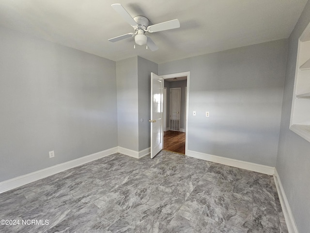 unfurnished room with ceiling fan