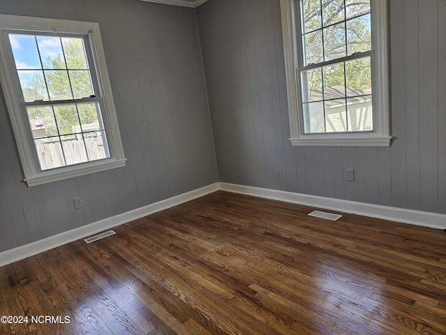 unfurnished room featuring hardwood / wood-style flooring