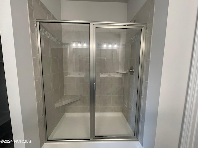 bathroom featuring an enclosed shower