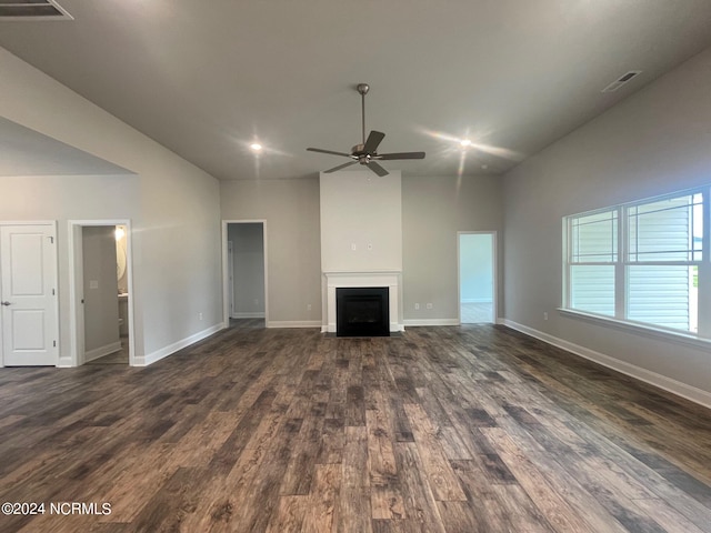 unfurnished living room featuring dark hardwood / wood-style floors and ceiling fan