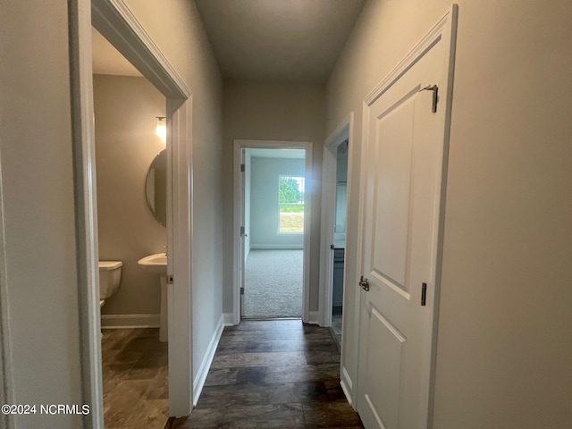 corridor featuring dark hardwood / wood-style floors