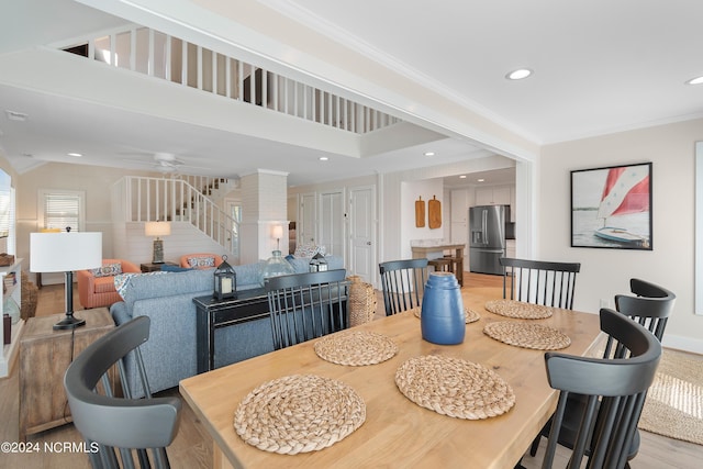 dining room with light wood-style flooring, recessed lighting, a ceiling fan, stairs, and crown molding