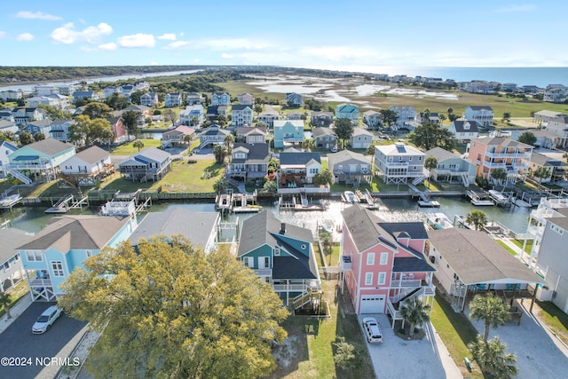 bird's eye view with a residential view and a water view