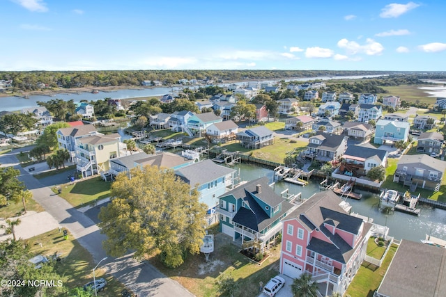 bird's eye view featuring a water view and a residential view