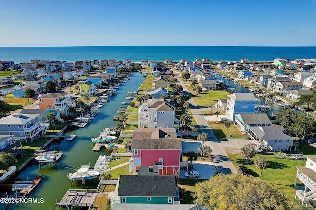 drone / aerial view featuring a water view and a residential view