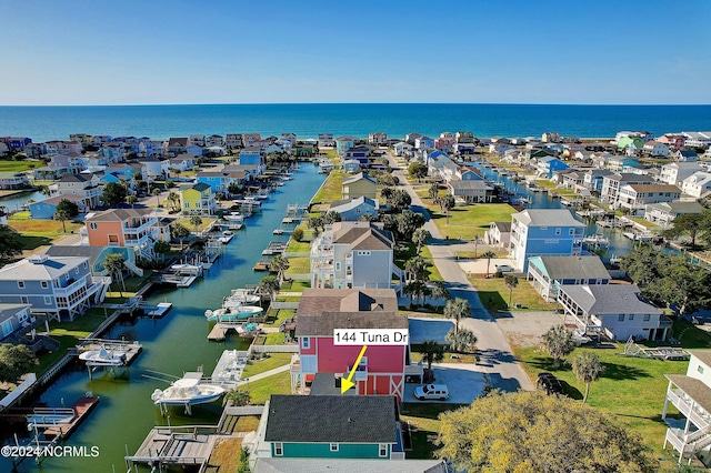 birds eye view of property featuring a water view and a residential view