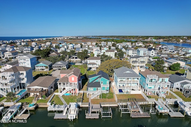 bird's eye view featuring a residential view and a water view