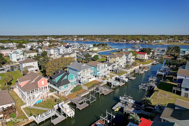 aerial view featuring a residential view and a water view