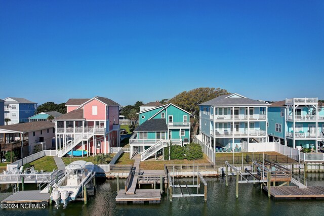 dock area with a balcony and a deck with water view