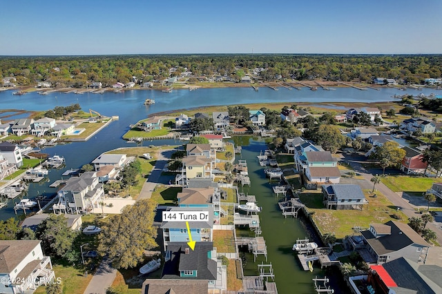 drone / aerial view featuring a water view and a residential view