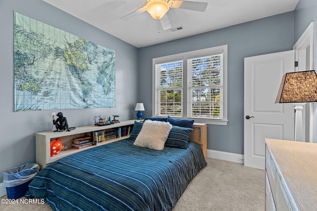 bedroom with light carpet and ceiling fan