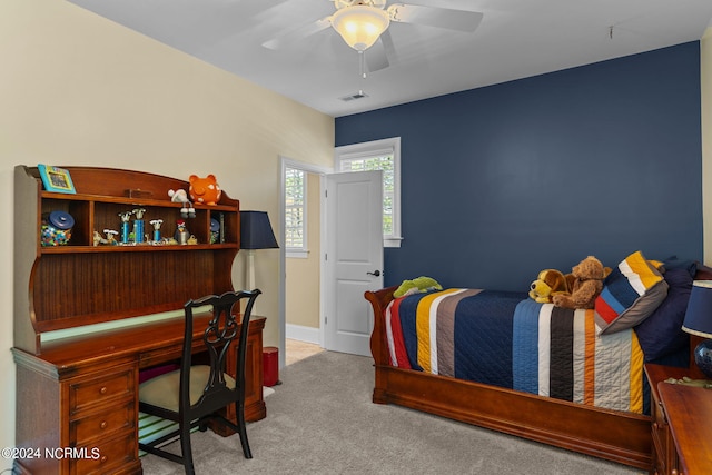 carpeted bedroom featuring ceiling fan