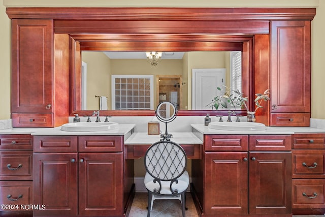 bathroom with vanity and a chandelier