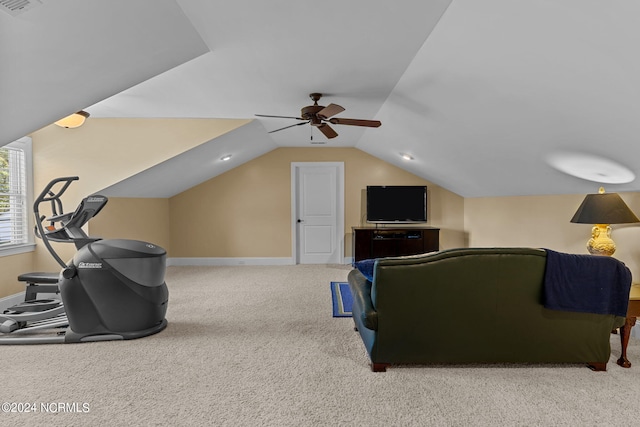 carpeted living room with vaulted ceiling and ceiling fan