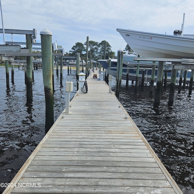 dock area with a water view