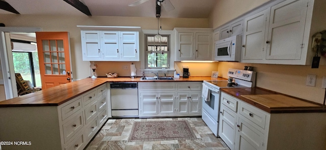 kitchen featuring wooden counters, white appliances, and white cabinetry