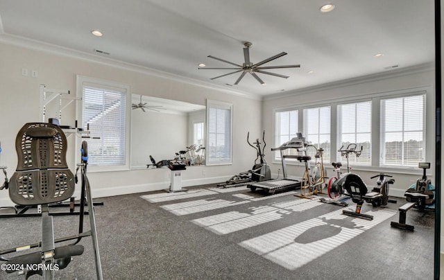 exercise area with crown molding, dark carpet, and ceiling fan