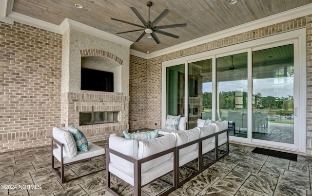 view of terrace with an outdoor living space with a fireplace and ceiling fan