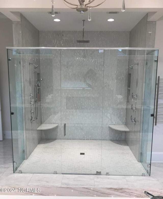 bathroom featuring an enclosed shower and tile floors