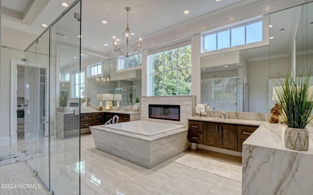 bathroom with ornamental molding, a notable chandelier, vanity, and tile flooring