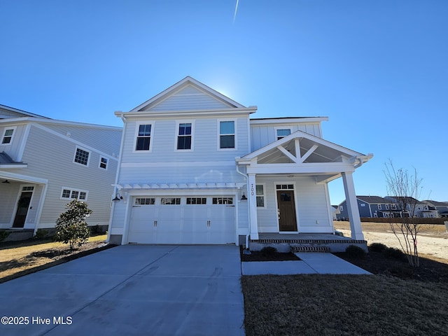 view of front of house with a porch, concrete driveway, and a garage