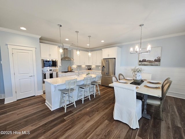 dining area featuring dark wood finished floors and crown molding