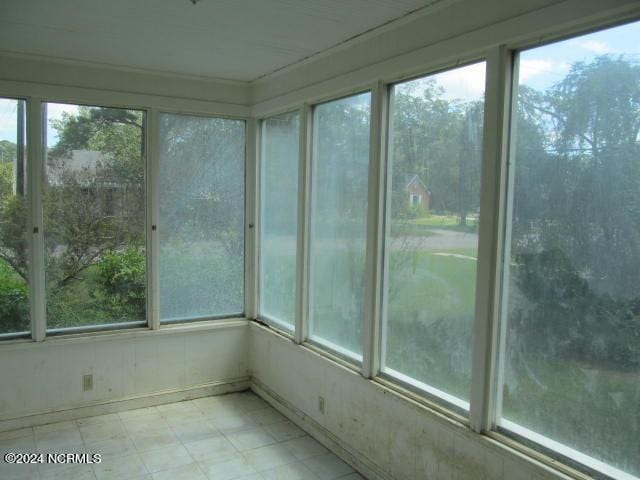 unfurnished sunroom with a wealth of natural light