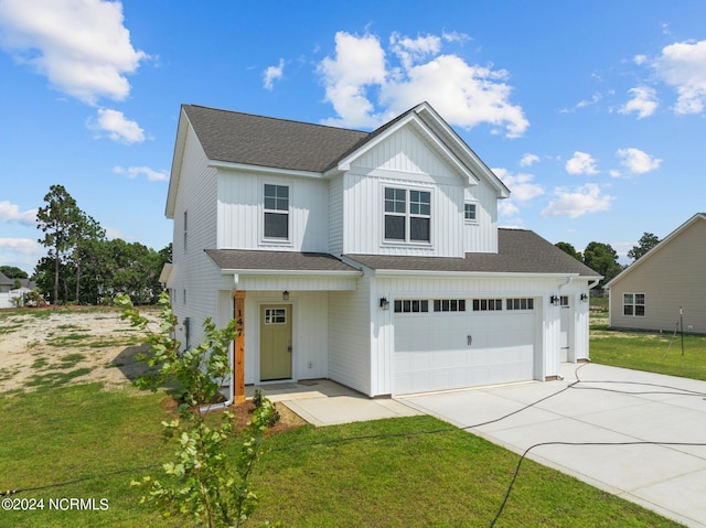 view of front facade featuring a garage and a front yard