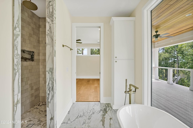 bathroom with ceiling fan and separate shower and tub