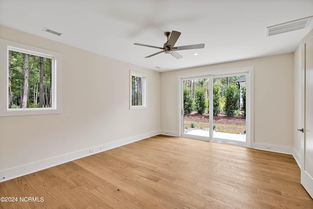 unfurnished room featuring light hardwood / wood-style floors and ceiling fan