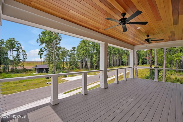 deck featuring a yard and ceiling fan