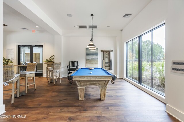 game room featuring plenty of natural light, dark wood-type flooring, and billiards