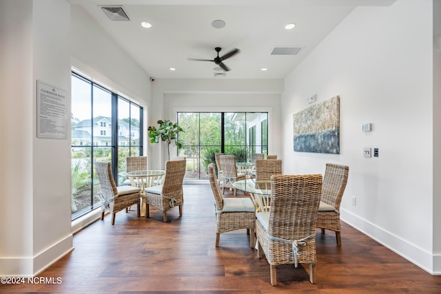 dining room with ceiling fan and dark hardwood / wood-style floors