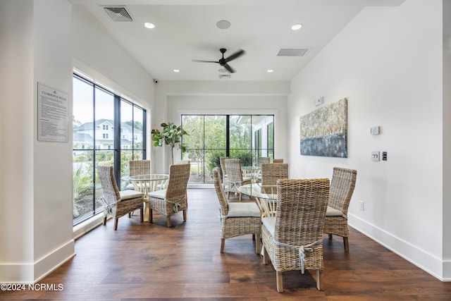 dining area with dark wood-type flooring, a wealth of natural light, and ceiling fan