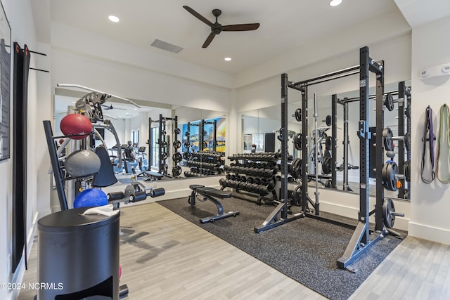 exercise room with hardwood / wood-style flooring and ceiling fan