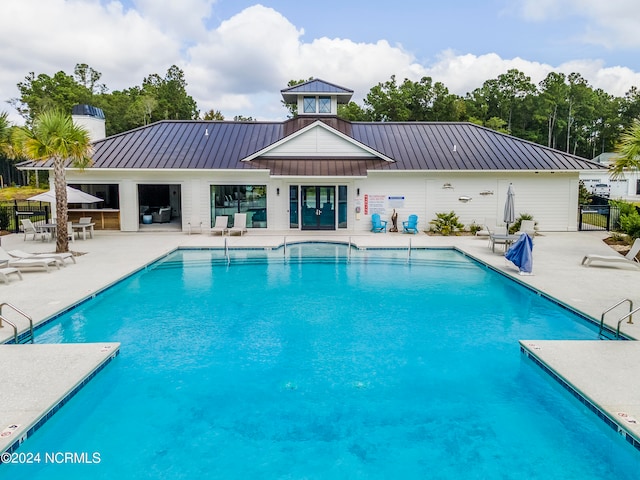 view of swimming pool with a patio