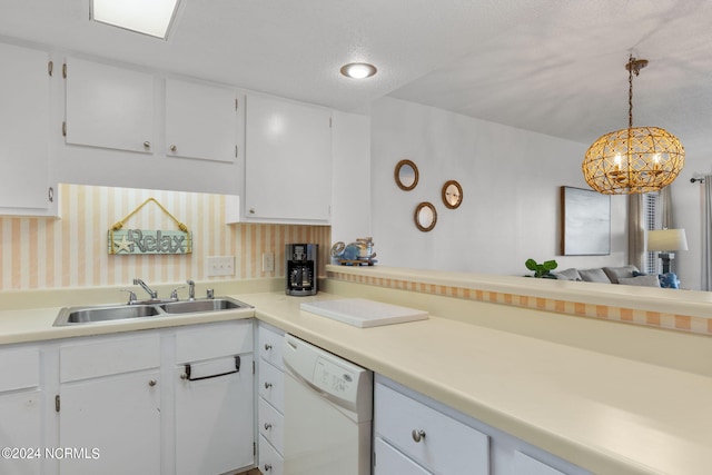 kitchen featuring dishwasher, pendant lighting, white cabinetry, and sink