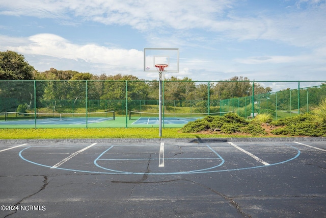 view of basketball court featuring tennis court