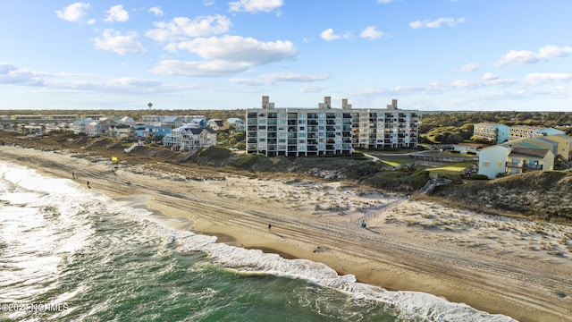 bird's eye view featuring a beach view and a water view