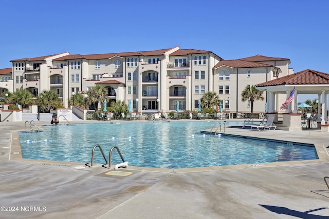 view of pool with a gazebo and a patio area