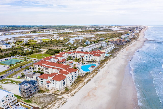 drone / aerial view featuring a view of the beach and a water view