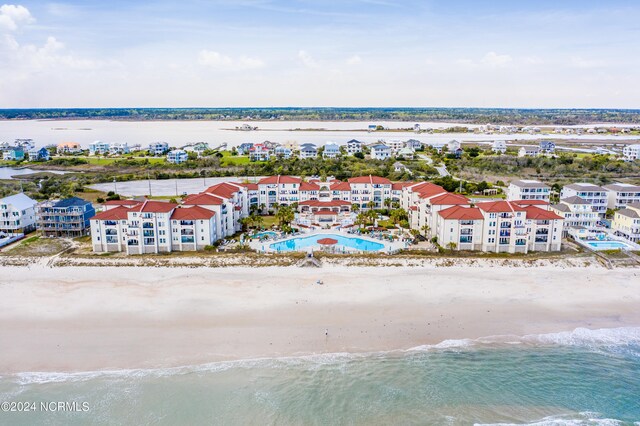 aerial view with a water view and a view of the beach